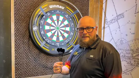 Tom Barkham's Extraordinary Darts Record Attempt for Hospice