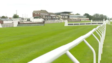 Weather Woes and Fiscal Fears: Exeter Racecourse’s Season Opener Cancelled Amid Ground Safety Concerns